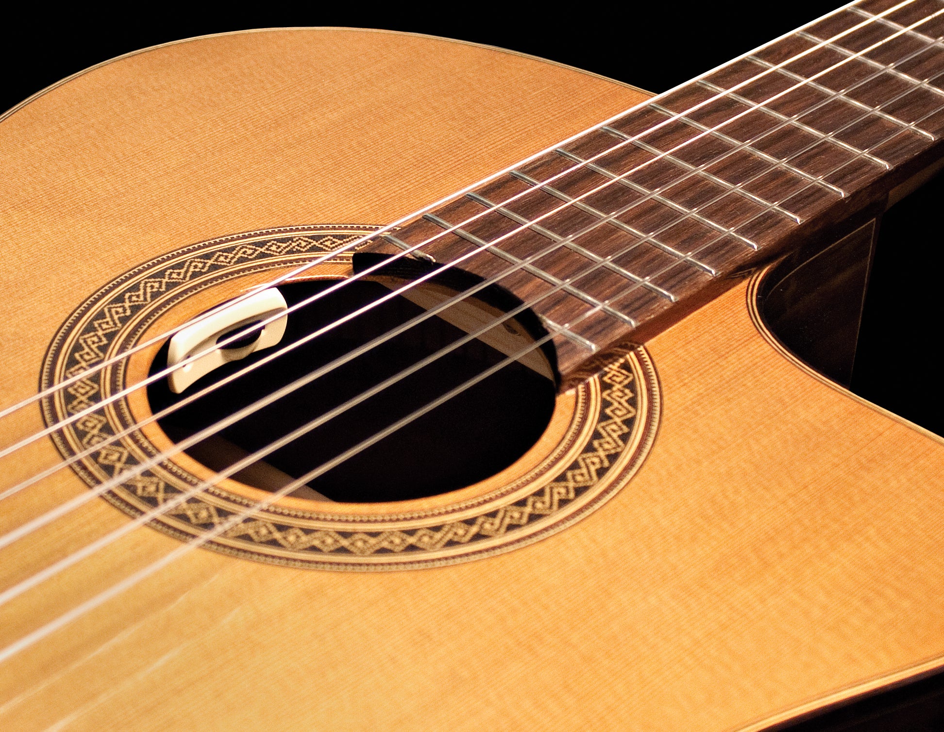 https://rocksolidmusic.co.za/wp-content/uploads/2020/02/Classical-Guitar-Soundhole-View.jpg