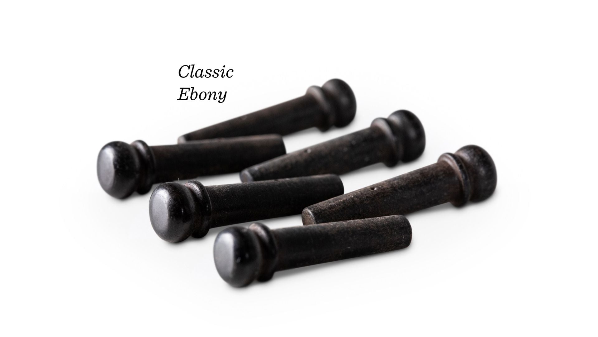 Set of six black ebony guitar bridge pins on a white background with 'Classic Ebony' text.